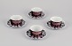 Bjørn Wiinblad for Rosenthal, Germany. A set of four "Berlin Hilton" coffee cups 
with saucers in porcelain. Glossy copper-colored decoration.