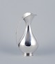 Sterling silver pitcher in a modernist and sleek design.