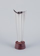 Tapio Wirkkala (1915-1985), Finnish silversmith. Modernist silver vase on a 
rosewood base.