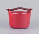 Timo Sarpaneva for Rosenlew, Finland. Cast iron pot in red enamel with wooden 
handle.