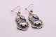 Earrings in silver, with pendant and inlaid turquoise.