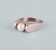 Danish goldsmith, 14 karat gold ring adorned with a cultured pearl. Modernist 
design.