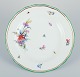 Meissen, Germany, porcelain plate hand-painted with floral motifs and insects.