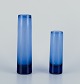 Per Lütken for Holmegaard, Denmark.
Two cylindrical art glass vases in blue glass.