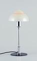 Fog & Mørup. Table lamp with a chrome stem, fitted with a "Spejlæg"(Fried Egg) 
glass shade.