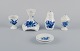 Royal Copenhagen Blue Flower Braided. Six pieces including a candlestick, egg 
cup, pepper shaker, salt shaker, and two butter dishes.
Various dating.