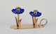 L'Art presents: Gunnar Ander for Ystad Metall, Sweden. Candlestick holder in brass and blue art glass shaped ...