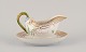 L'Art presents: 
Royal 
Copenhagen 
Flora Danica 
sauce boat on a 
pedestal with a 
leaf-shaped 
handle.