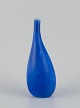 Stig Lindberg for Gustavsberg, Sweden. Ceramic vase with a slender neck. Glazed 
in blue tones.