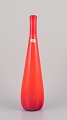 Murano, Italy. Large art glass vase with a slender neck in orange mouth-blown 
glass.