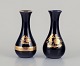 Limoges, 
France. Two 
porcelain vases 
decorated with 
...