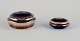 Limoges, 
France. Two 
lidded 
porcelain jars 
decorated ...
