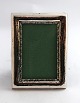 Silver photo frame (830). Measures 9*12 cm. Measurements for photo 5.5*8.6 cm. 
Produced 1928.