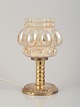 Helena Tynell, Finnish glass artist, for Limburg.
Designer table lamp in clear glass and metal.