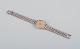 Longines 
ladies' 
wristwatch in 
brass and 
stainless 
steel.