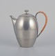 Just Andersen, early Art Deco coffee pot in pewter, handle in wickerwork.