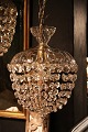 Old Prism chandelier with glass top shade and lots of clear diamond-cut glass 
prisms...