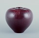 Gerd Bøgelund, Danish ceramist, for Royal Copenhagen.
Ceramic vase in ox-blood glaze.