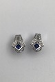 Danam Antik 
presents: 
Danish 14 
K Whitegold Ear 
Studs w Saphir 
& Diamonds