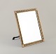 German designer. Art Nouveau table mirror in brass.