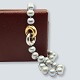 Antik 
Damgaard-
Lauritsen 
presents: 
Ole 
Lynggaard; 
Fidelity clasp 
set with a 
pearl necklace 
of tahiti 
pearls