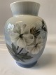 Antik Huset 
presents: 
Royal 
Copenhagen Vase 
with White 
Flowers and 
Butterfly
Dec. No. 
#2667/#36
Height 17 cm.