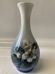 Antik Huset 
presents: 
Royal 
Copenhagen Vase 
with tall 
slender neck, 
with Apple 
blossom
Dec. No. 53 - 
51