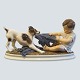 Dahl Jensen; 
Porcelain 
figurine of boy 
and dog No. 
1072