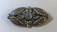 Georg Jensen. 
Brosche aus 
Sterlingsilber 
mit Mondstein. 
...