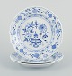 Meissen, three 
Blue Onion 
patterned 
plates in 
porcelain.