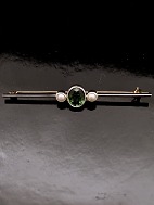 14 karat guld stav broche med turmalin