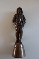 An old figure, 
he is perhaps 
an angler, made 
of ...