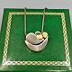 Antik 
Damgaard-
Lauritsen 
presents: 
Anette 
Kræn; Necklace 
in sterling 
silver with 
gold and bone