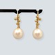 Dulong; Pair of 
Delphis Pearl 
earrings in 18 
kt. gold ...