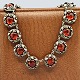 N. E. From; A 
necklace of 
sterling silver 
with amber
