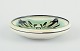 Kähler, Denmark.
Ceramic bowl with floral motif. Glaze in green and black tones.