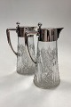 A pair of Hespe 
Glass Carafes 
with silver 
mountings