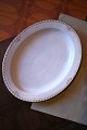 Rare oval Royal Copenhagen serving dish in Princess with gold decorations. 
41x32.5cm.
1850-70...