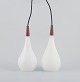 L'Art presents: 
A pair of 
Louis Poulsen 
pendants in 
opal glass and 
precious wood.