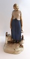 Bing & 
Gröndahl. 
Porcelain 
figurine. Goose 
girl. Model ...