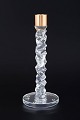 L'Art presents: 
Orrefors, 
Sweden
Candleholder 
in clear 
crystal with 
faceted, 
sculptural 
shaft and brass 
...