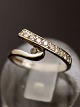 14 carat white 
gold ring size 
48 with several 
diamonds