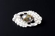 Kaj Bojesen, Randers
Oval silver brooch set with a cabochon-cut cat’s eye (chrysoberyl).