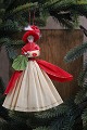 K&Co. presents: 
Old 
Christmas tree 
ornament, nice 
lady with 
sleeve and bag 
made of colored 
crepe paper...