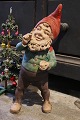 K&Co. presents: 
Antique 
terracotta 
gnome with old 
paint and a 
fine patina...