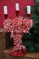 K&Co. presents: 
Old 
Swedish 
Christmas 
candlestick in 
red painted 
wood 
decorated with 
tissue paper...