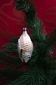 K&Co. presents: 
Old 
Christmas tree 
ornament in the 
shape of a 
small glass 
fish from 1940.