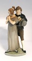 Lundin Antique 
presents: 
Royal 
Copenhagen. 
Porcelain 
figurine. Man & 
Woman. Model # 
1680. Height 26 
cm. (1 quality)