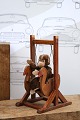 K&Co. presents: Cute, small plush monkey sitting in an old wooden swing...