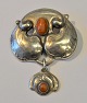 Pegasus – Kunst - Antik - Design presents: Danish silversmith, 20th century: Jugend brooch with amber.